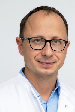Dr. Christian Heinzelmann